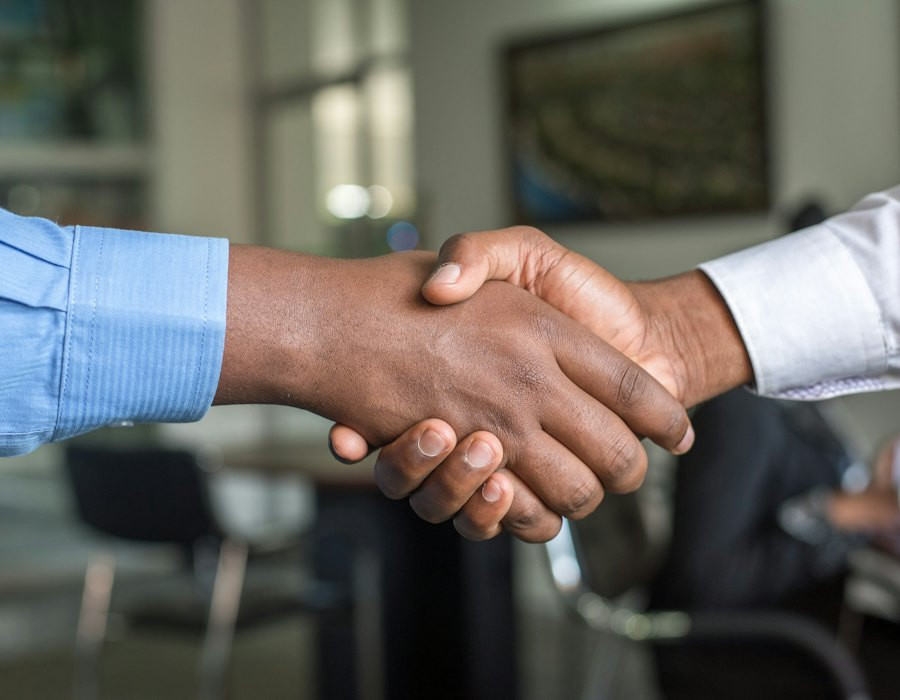 Client and advocate shaking hands after a consultation