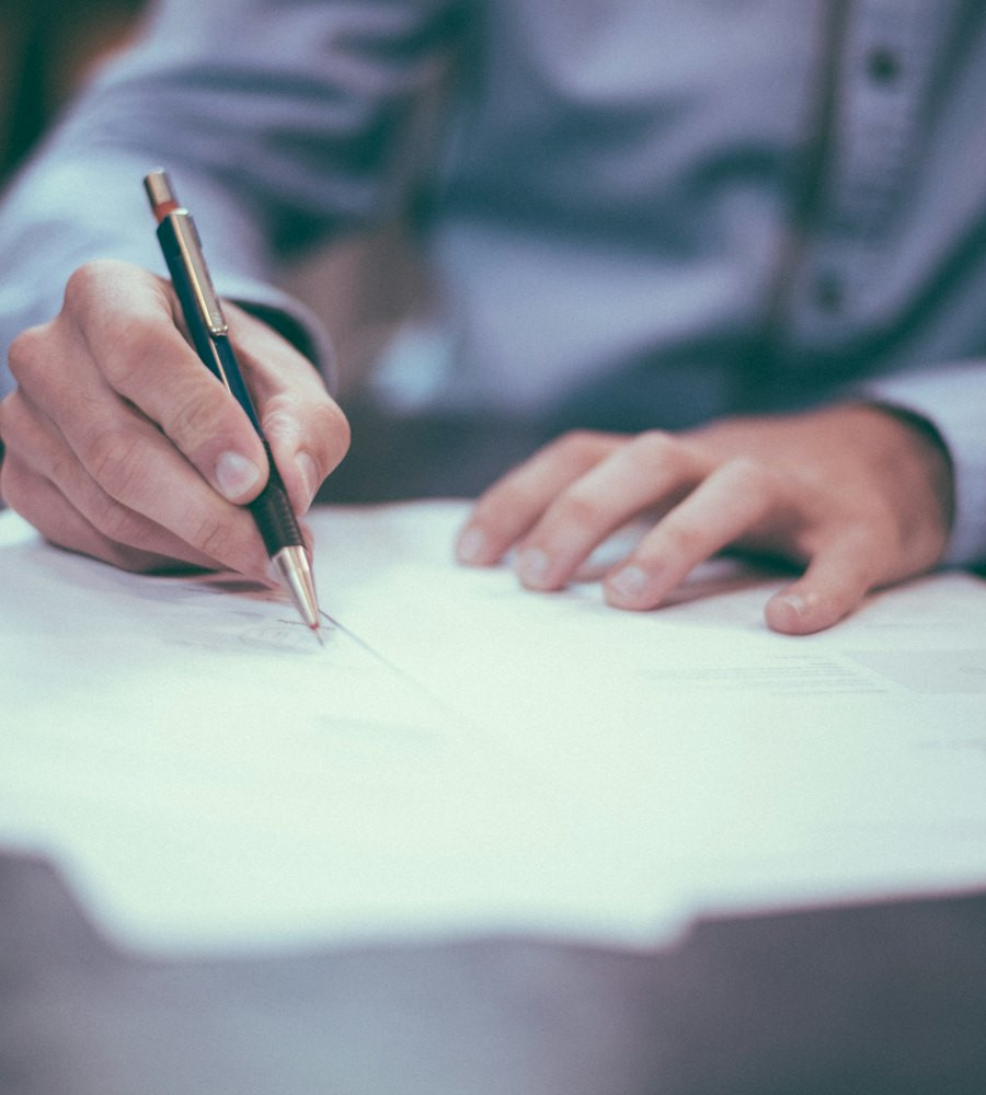 Advocate reviewing legal documents during a consultation in Delhi